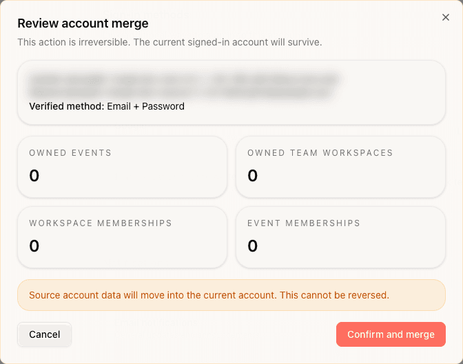 Review account merge dialog with blurred email addresses